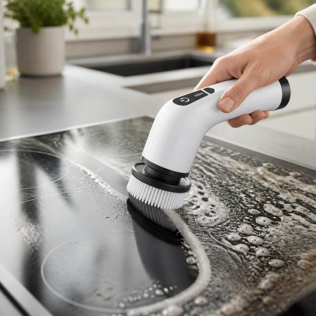 Spin scrubber cleaning a glass stovetop