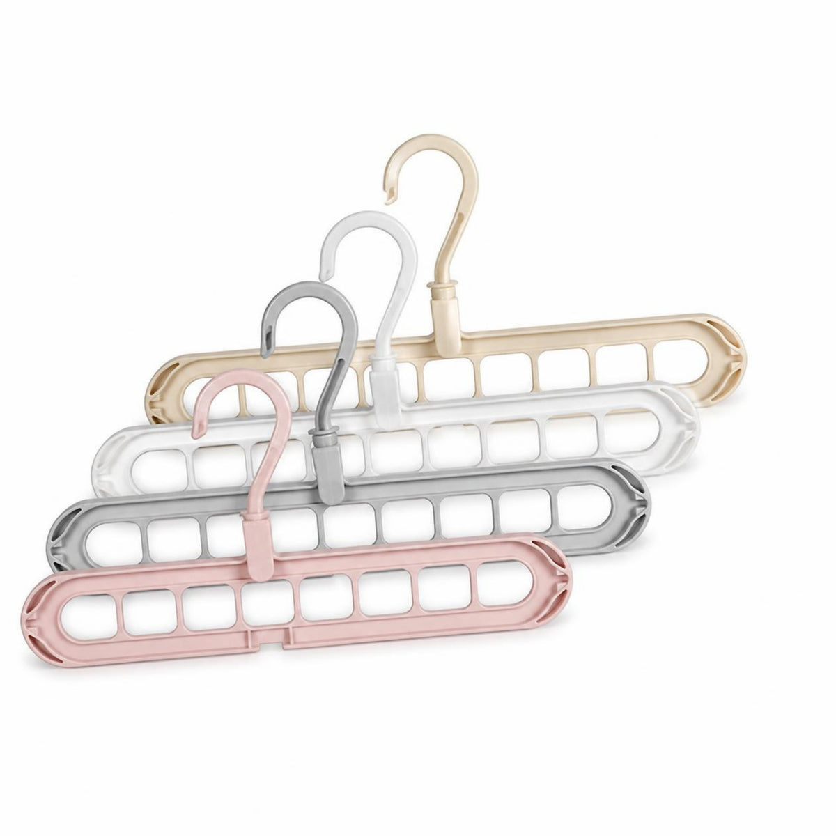 Space-saving multi-hole clothes hangers in pink, gray, white and beige